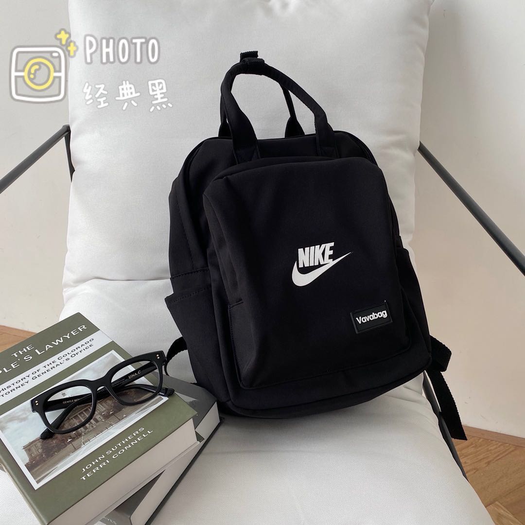 Nikeกระเป๋าเป้สะพายหลังnike2 ใหม่สีชมพูกระเป๋าถือหวานแว๋วกระเป๋านักเรียนนักศึกษาลมกระเป๋าสะพายเดินทางกระเป๋าคอมพิวเตอร์