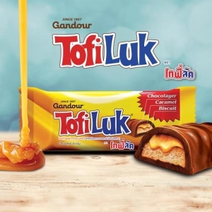ภาพหน้าปกสินค้าโทฟี่ลัค (Tofiluk) 1 กล่องบรรจุ 13 ชิ้น บิสกิตเคลือบคาราเมลและครีมช็อกโกแลตนม ที่เกี่ยวข้อง